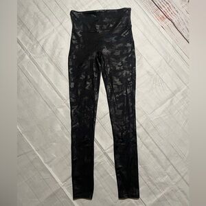 Spanx Faux Leather Camo Leggings in a matte black camo finish. Size S